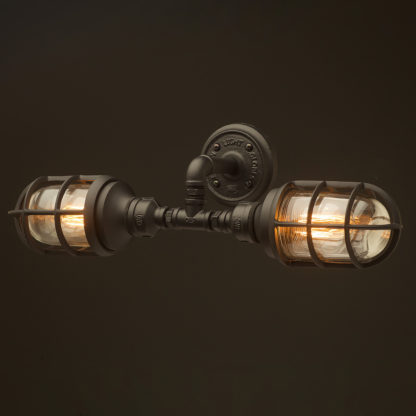Outdoor black plumbing pipe twin bunker cage wall light